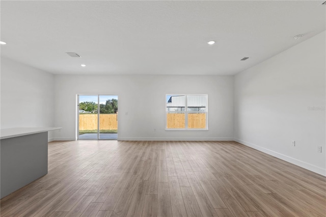 spare room featuring light wood-type flooring