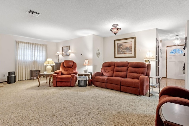 carpeted living room featuring a textured ceiling