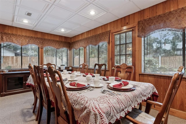 carpeted dining space with a wealth of natural light