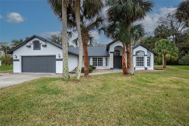 ranch-style home with a garage and a front lawn