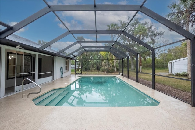 pool with a lanai and a patio area