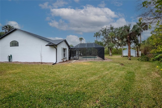 view of yard with a lanai and an outdoor pool