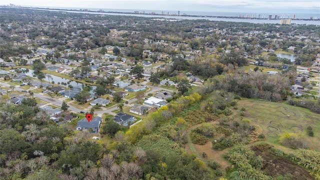 drone / aerial view featuring a water view and a residential view