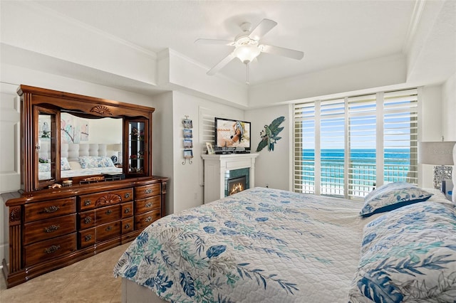 bedroom with ornamental molding, light tile patterned floors, and ceiling fan