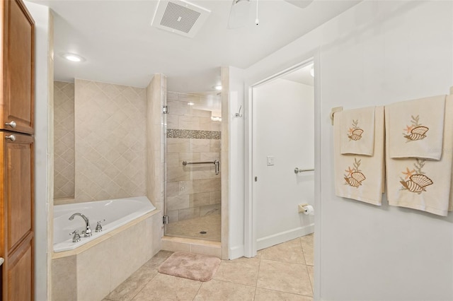 bathroom featuring tile patterned flooring, plus walk in shower, and ceiling fan