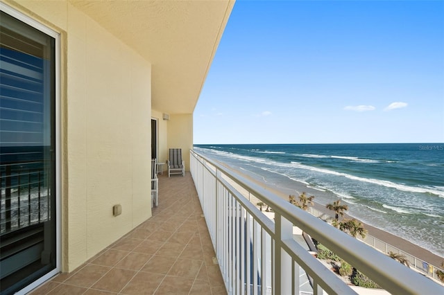 balcony with a view of the beach and a water view