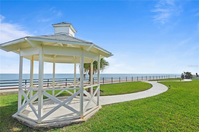 view of home's community featuring a yard, a gazebo, and a water view