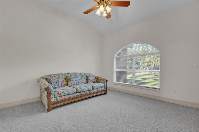 sitting room featuring ceiling fan, carpet floors, and vaulted ceiling