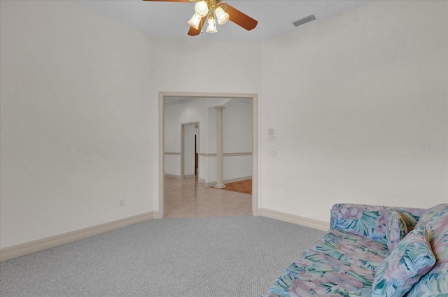 unfurnished room featuring light carpet and ceiling fan