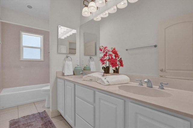 bathroom with vanity, tile patterned floors, a bathtub, and toilet