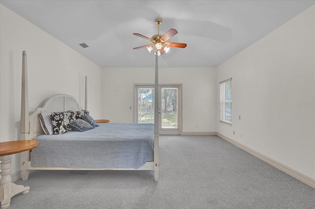 bedroom with ceiling fan, light colored carpet, and access to outside