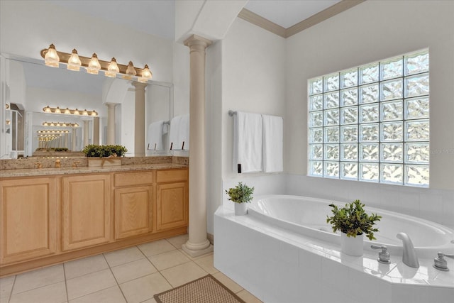 bathroom with vanity, tiled bath, tile patterned flooring, and ornate columns