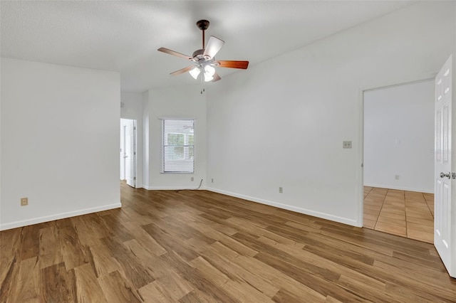 empty room featuring light hardwood / wood-style floors and ceiling fan