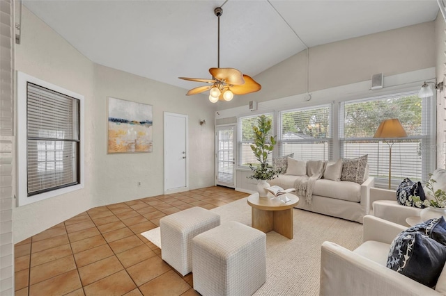 living room with light tile patterned flooring, lofted ceiling, and ceiling fan