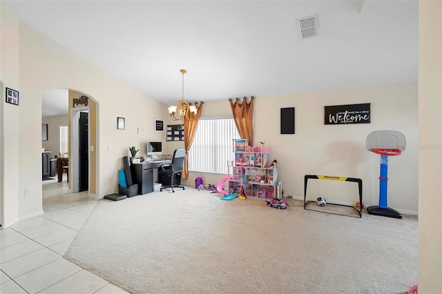 rec room with light tile patterned floors and a notable chandelier