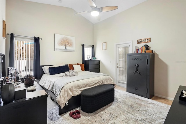 bedroom with high vaulted ceiling and ceiling fan