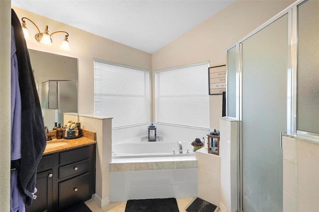 bathroom featuring tile patterned floors, vanity, lofted ceiling, and separate shower and tub