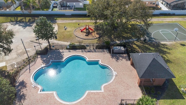 community pool featuring a patio area and fence