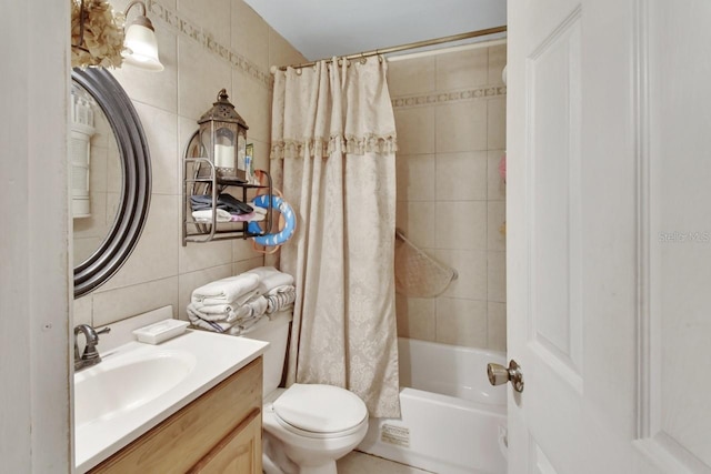 full bathroom with tile walls, vanity, decorative backsplash, toilet, and shower / bath combo with shower curtain