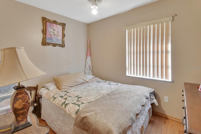 bedroom with light hardwood / wood-style floors