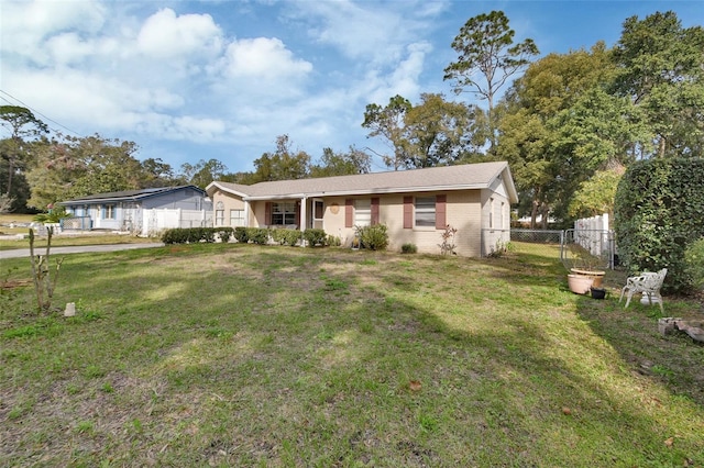 single story home featuring a front yard