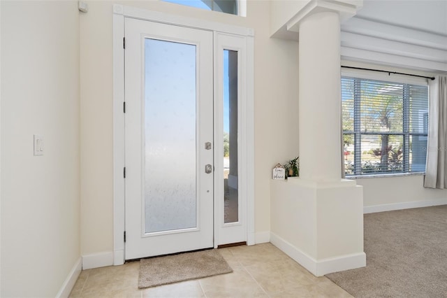 entrance foyer with baseboards and light tile patterned flooring