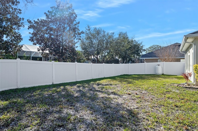 view of yard featuring a fenced backyard