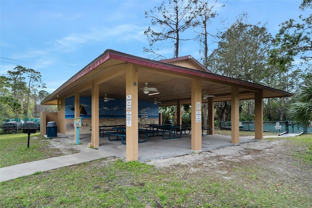 view of community with a patio and fence