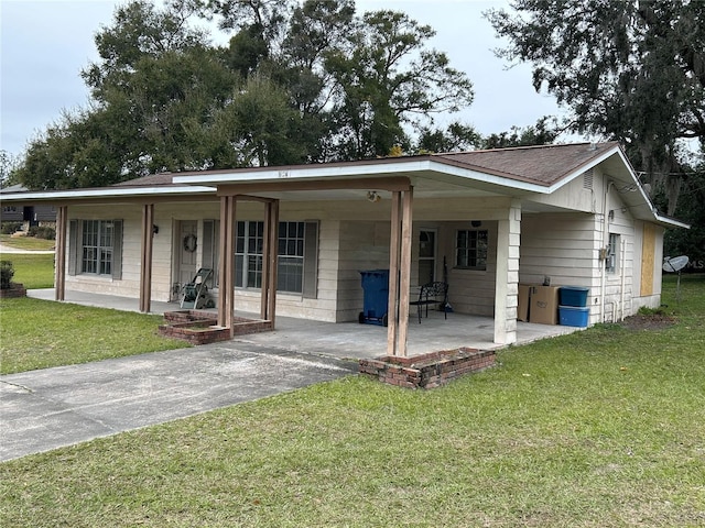 view of front of home featuring covered porch and a front yard