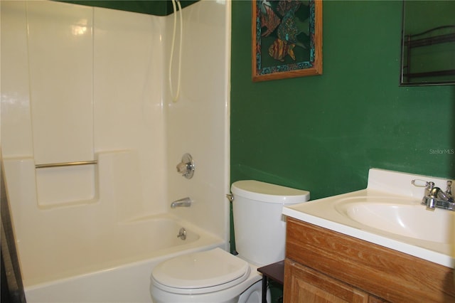 full bathroom featuring shower / bathing tub combination, toilet, and vanity