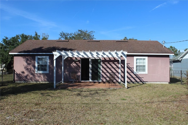 back of house featuring a yard