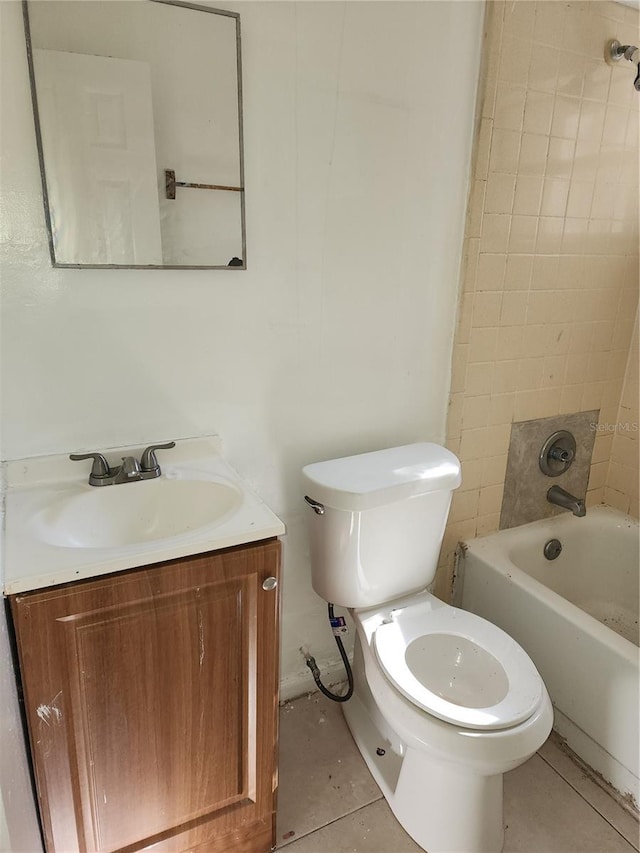 full bathroom with vanity, tiled shower / bath, tile patterned flooring, and toilet