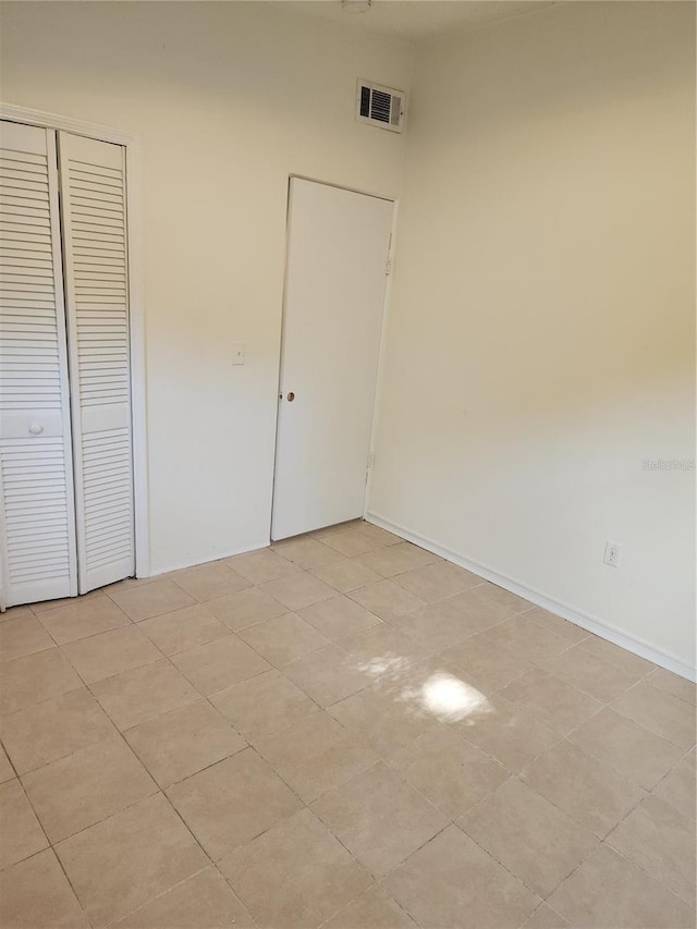 unfurnished bedroom with a closet