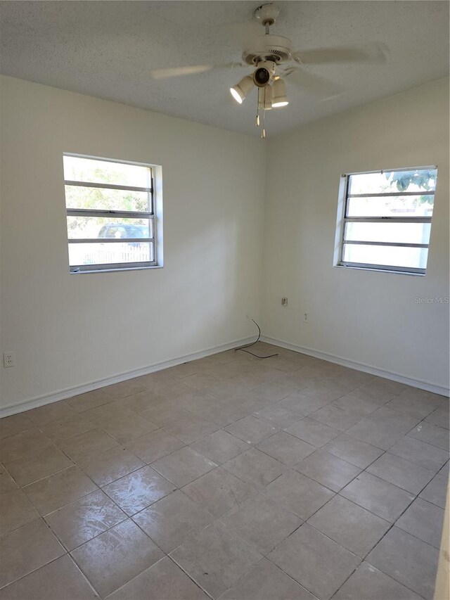 spare room featuring ceiling fan