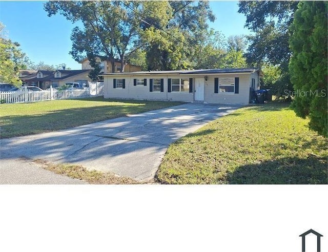 ranch-style house with a front lawn