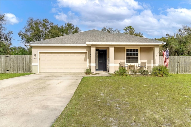 view of front of house featuring a porch, a garage, and a front yard