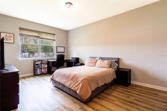 bedroom with light hardwood / wood-style flooring