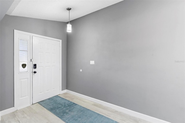 entryway with wood-type flooring