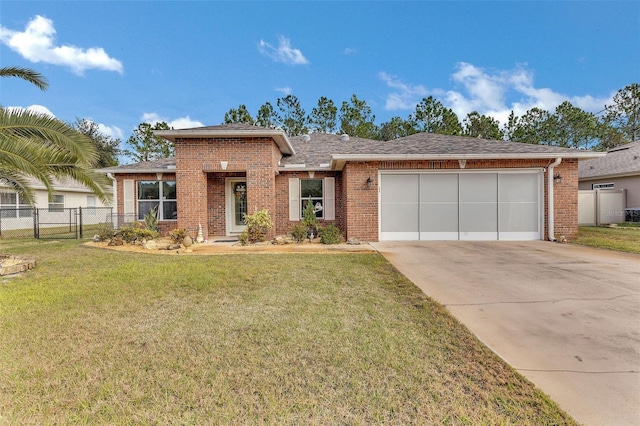 view of front of house with a front yard and a garage