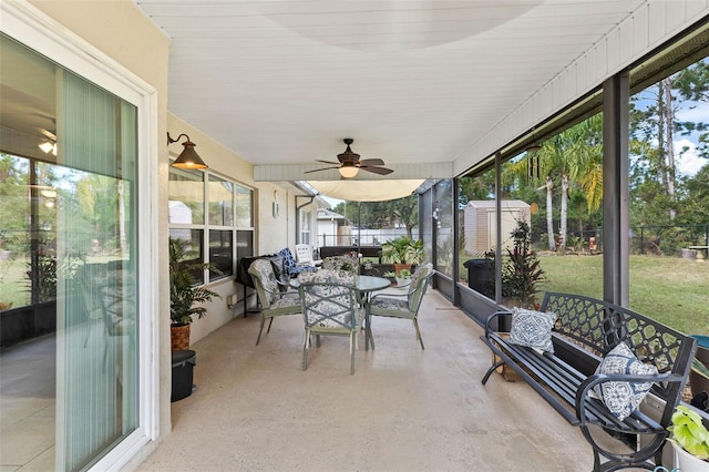 sunroom featuring ceiling fan