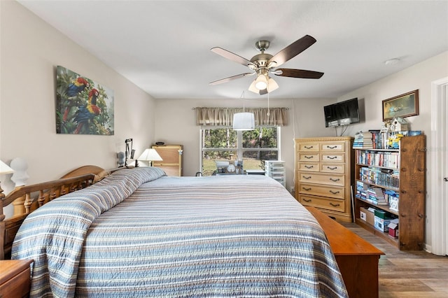 bedroom featuring light hardwood / wood-style flooring and ceiling fan