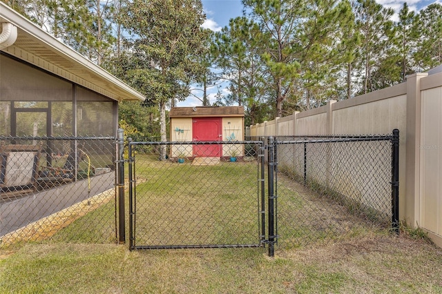 view of gate featuring a yard