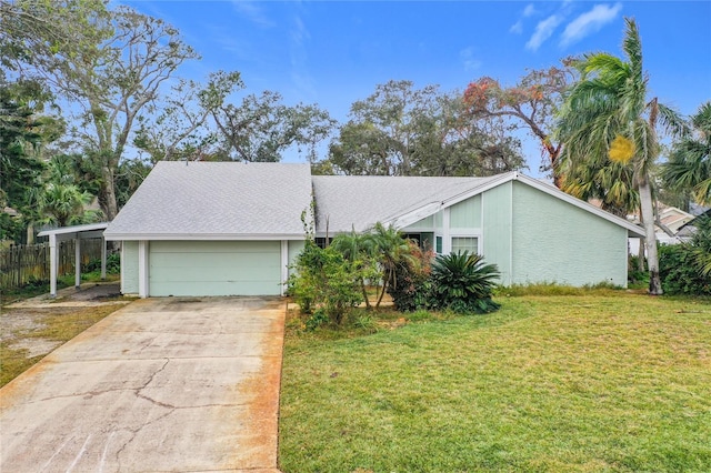 ranch-style home with a garage, a front yard, and a carport