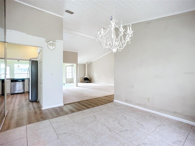 unfurnished dining area featuring wooden ceiling, light tile patterned floors, and a notable chandelier