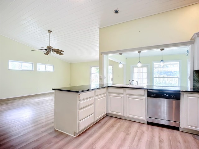 kitchen featuring sink, white cabinetry, vaulted ceiling, light wood-type flooring, and dishwasher