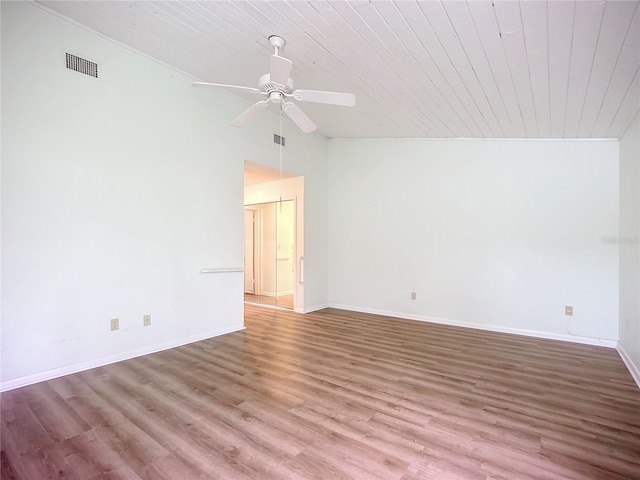 spare room with wood ceiling, ceiling fan, vaulted ceiling, and hardwood / wood-style floors