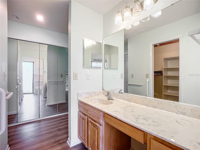 bathroom featuring vanity and hardwood / wood-style floors