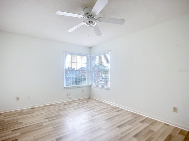 unfurnished room featuring ceiling fan and light wood-type flooring