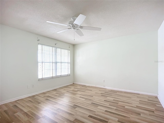 unfurnished room featuring ceiling fan, a textured ceiling, and light wood-type flooring