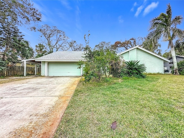 ranch-style house with a garage and a front yard